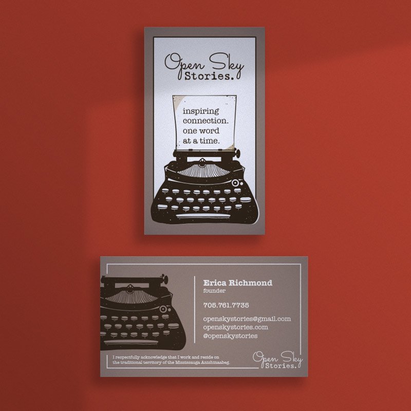 Open Sky Stories business card with typewriter illustration on burnt orange background.