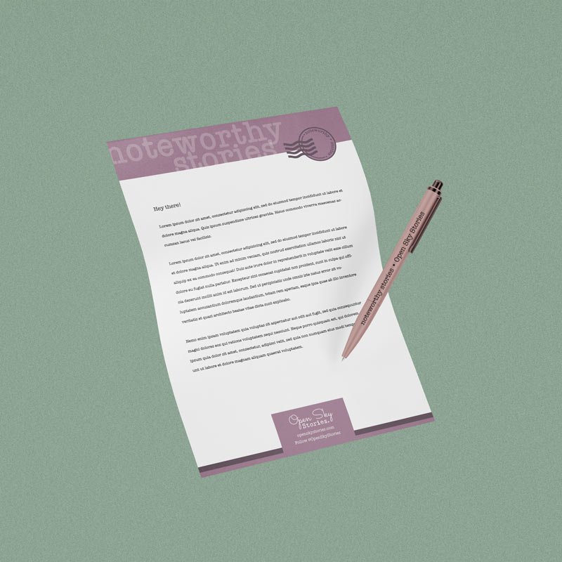 Noteworthy Stories letterhead paper with pen floating on a sage green background.